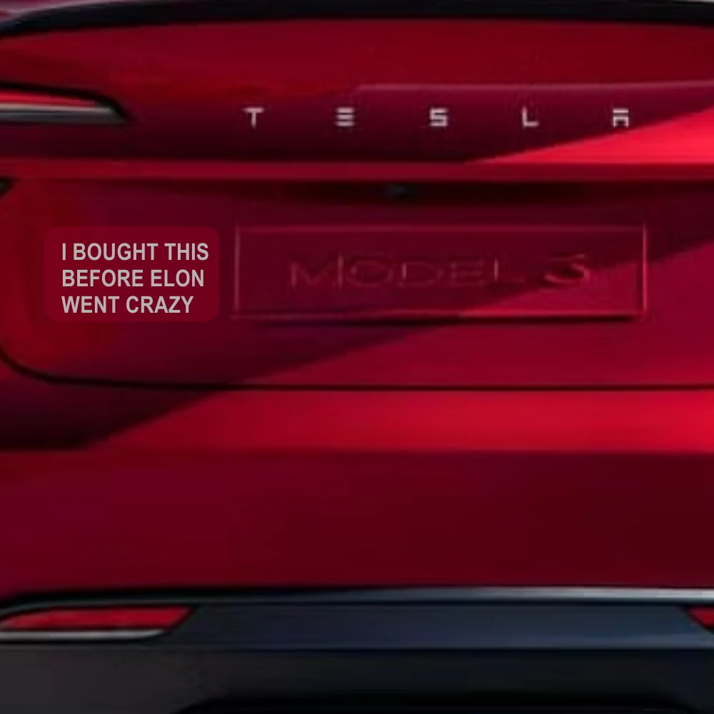 Tesla tailgate with a sticker reading 'I bought this before Elon went crazy'